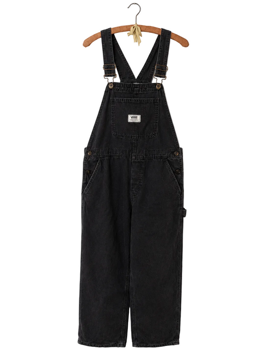 Black denim bib overalls hanging on a wooden hanger against a plain white background. The overalls feature adjustable shoulder straps, a front patch pocket with a small Vans label, and side cargo pockets.
